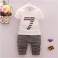 Spring and autumn new boys and girls zipper striped trousers suit